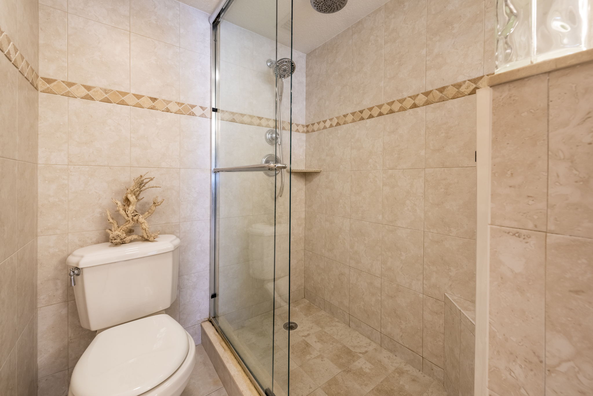 ... and floor-to-ceiling tiled shower