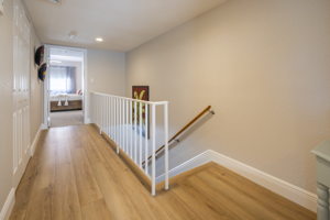 Staircase to 2nd floor leads to two bedrooms, two bathrooms and laundry