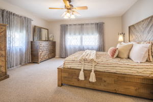 Large master bedroom overlooking pool