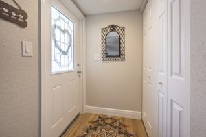 A lighted entry to main living. Large hallway closet opposite door.