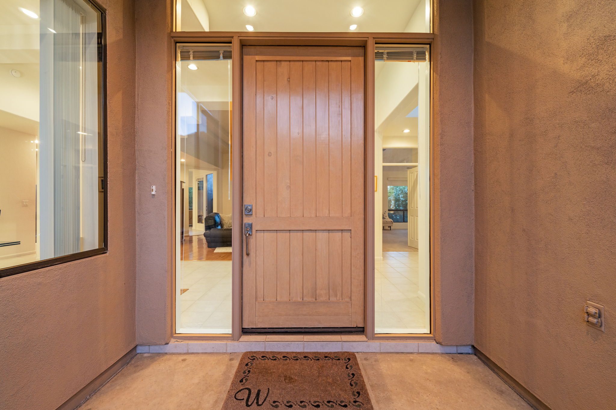 Beautiful wood entry door with glass sidelights