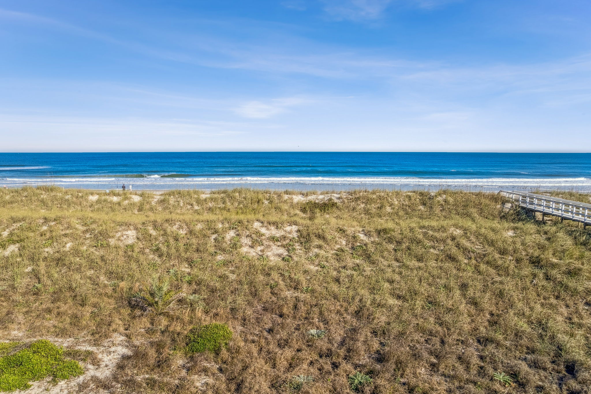 ... and unfolds across dunes, beach, and sea.