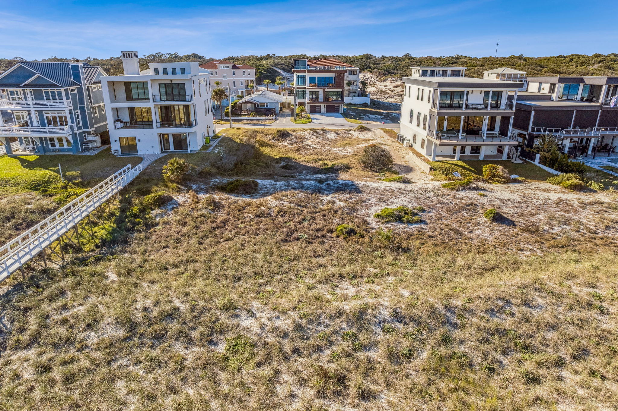 Naturally elevated rolling dunes provide a protective buffer ...