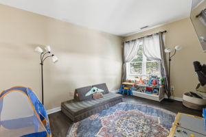 Front 3rd bedroom currently used as a playroom and office space.