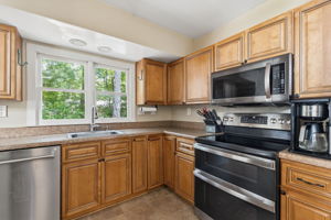 Updated kitchen with newer stainless steel appliances.