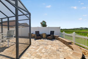 Extended Rear and Side Paver Patio with Privacy Fencing and Tiered Wall