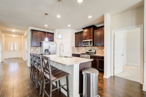 24 Kitchen w Foyer + Main BR