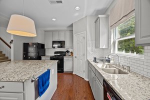 Granite, subway tile backsplash, kitchen island, walk-in pantry