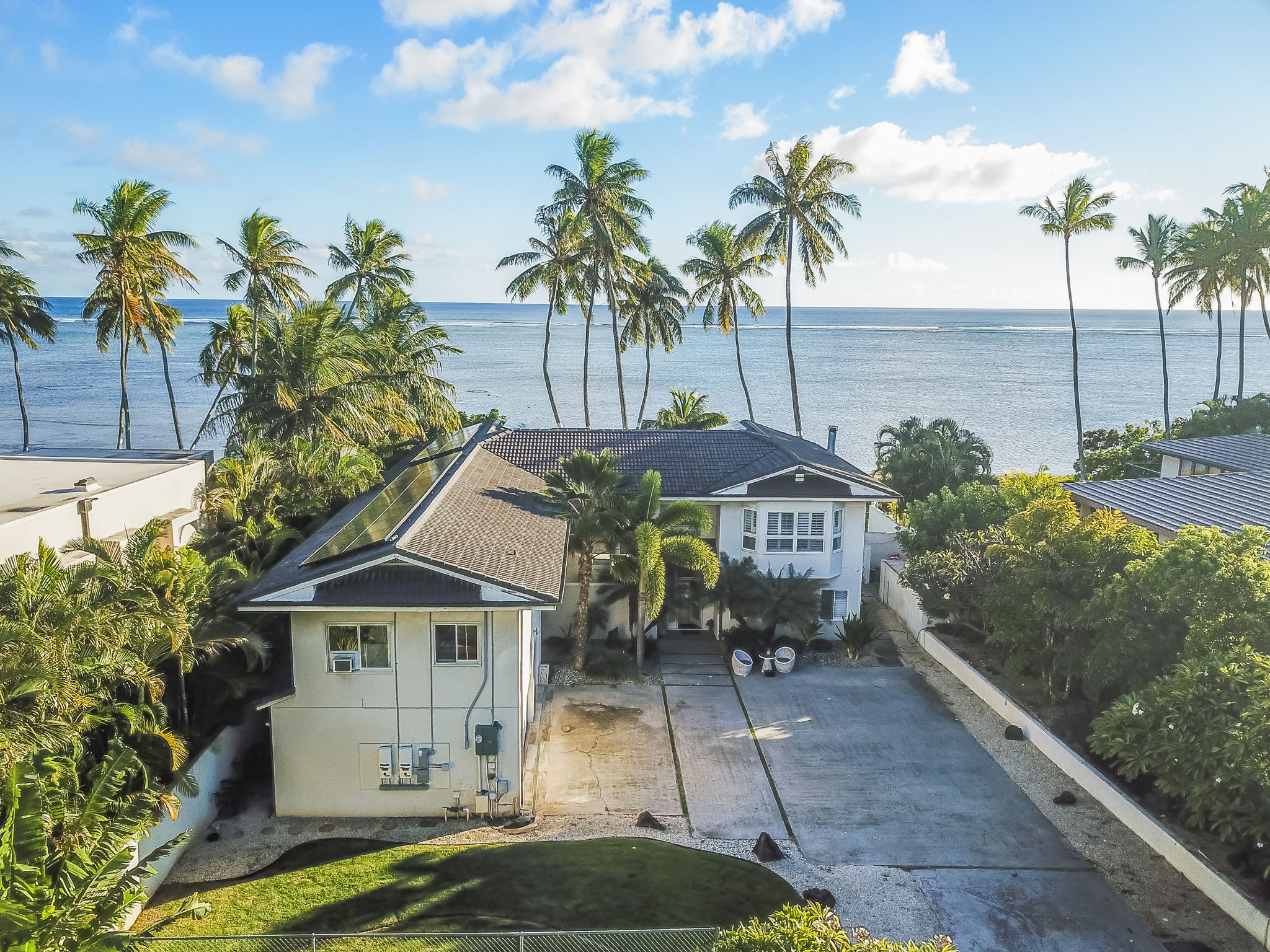 Beautiful Oceanfront with 3-car garage and room for 8 extra cars inside the gate!