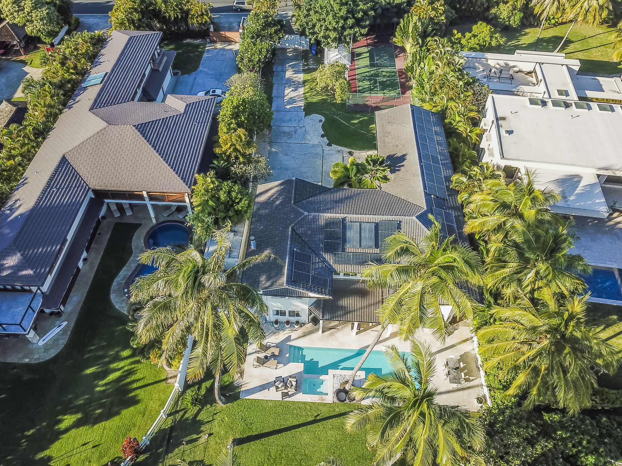 Aerial view of the home from above the beach