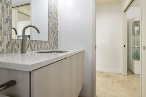 foyer bathroom close to front door, living room+tv room
