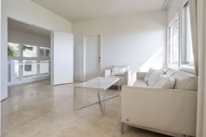 double doors at the top south end of the hall, opens up to the Master Bedroom suite opens