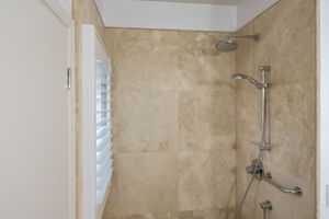 Downstiars bathroom, located behind the kichen also has a shower