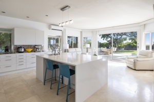 XL kitchen island, looking out to sitting area and pool