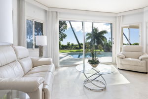 Sitting area, looks out to the pool and backyard