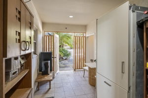between the main house & garage, gate from front