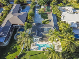 Aerial view of the home from above the beach