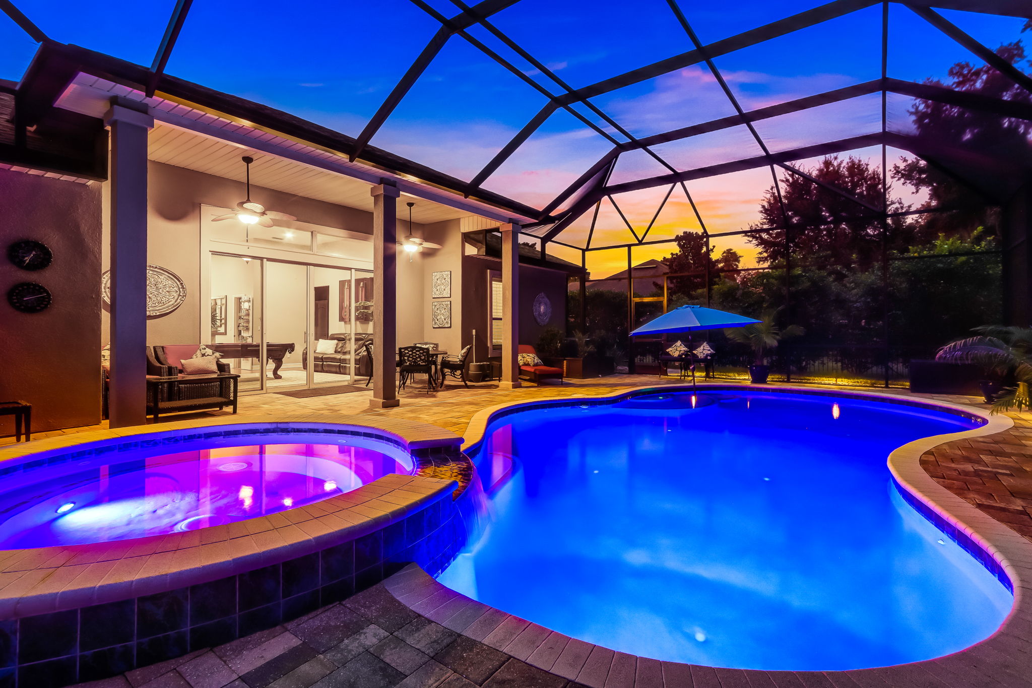 The covered screened lanai provides ultimate poolside relaxation