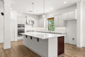 The kitchen is huge and has been updated with new quartz counters, backsplash, paint, and lighting.