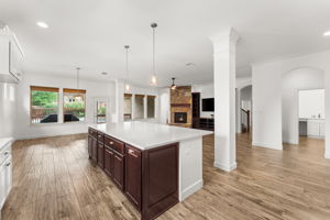 The living spaces are all open and overlook the beautiful backyard.