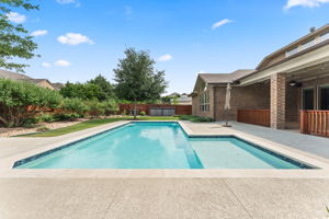 The pool features a large shallow section.