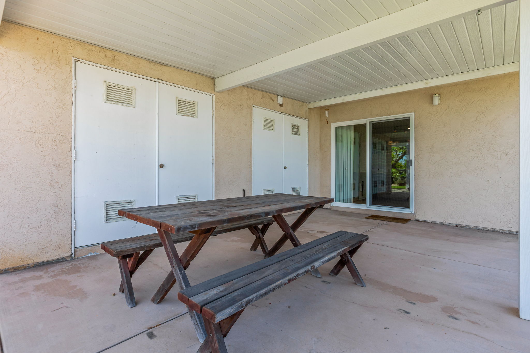 Secondary back patio w two very large storage closets