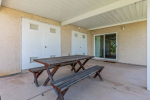 Secondary back patio w two very large storage closets