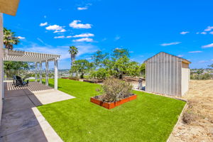 Backyard has workshop shed