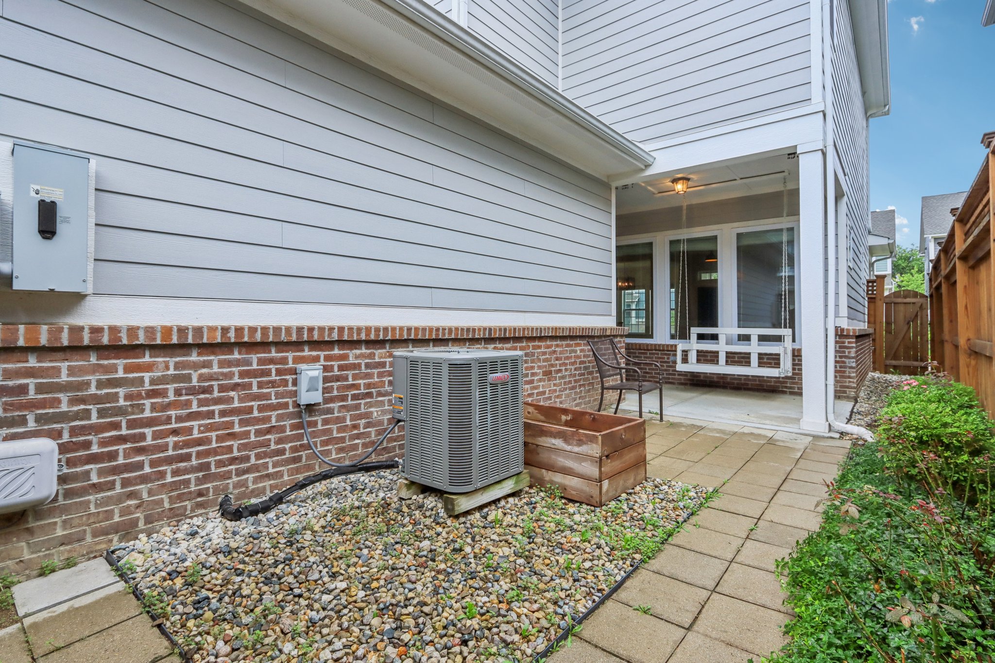 ow-maintenance side yard with easy access to utilities and direct entry to the backyard oasis.