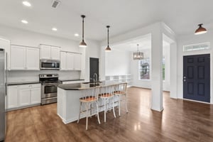 Stunning chef’s kitchen with stainless appliances, granite counters, and space to gather, cook, and connect.