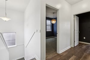 Spacious second-level landing with natural light and room to breathe between bedrooms