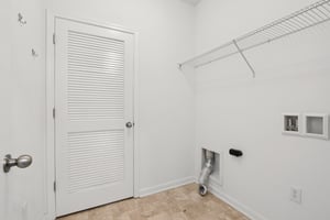 Dedicated laundry room with extra storage and utility space to keep things tidy and efficient.