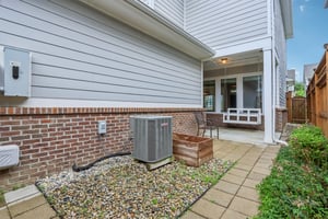 ow-maintenance side yard with easy access to utilities and direct entry to the backyard oasis.