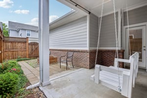 Relax and unwind on your covered patio, complete with porch swing and fully fenced privacy.
