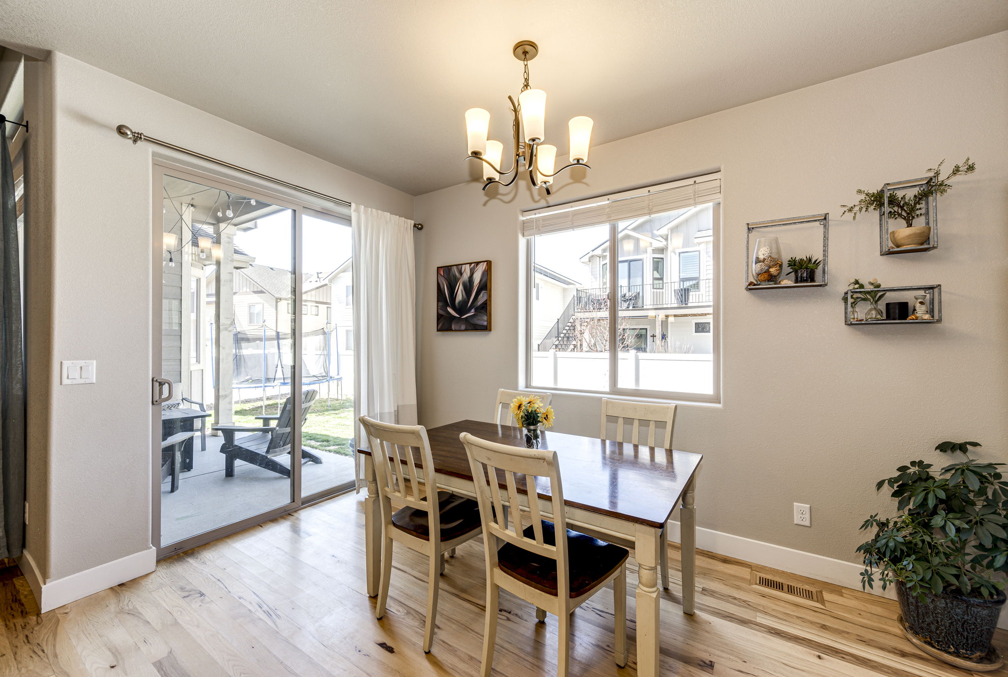 Eat-in space off of the kitchen with patio doors leading out onto your backyard covered deck area