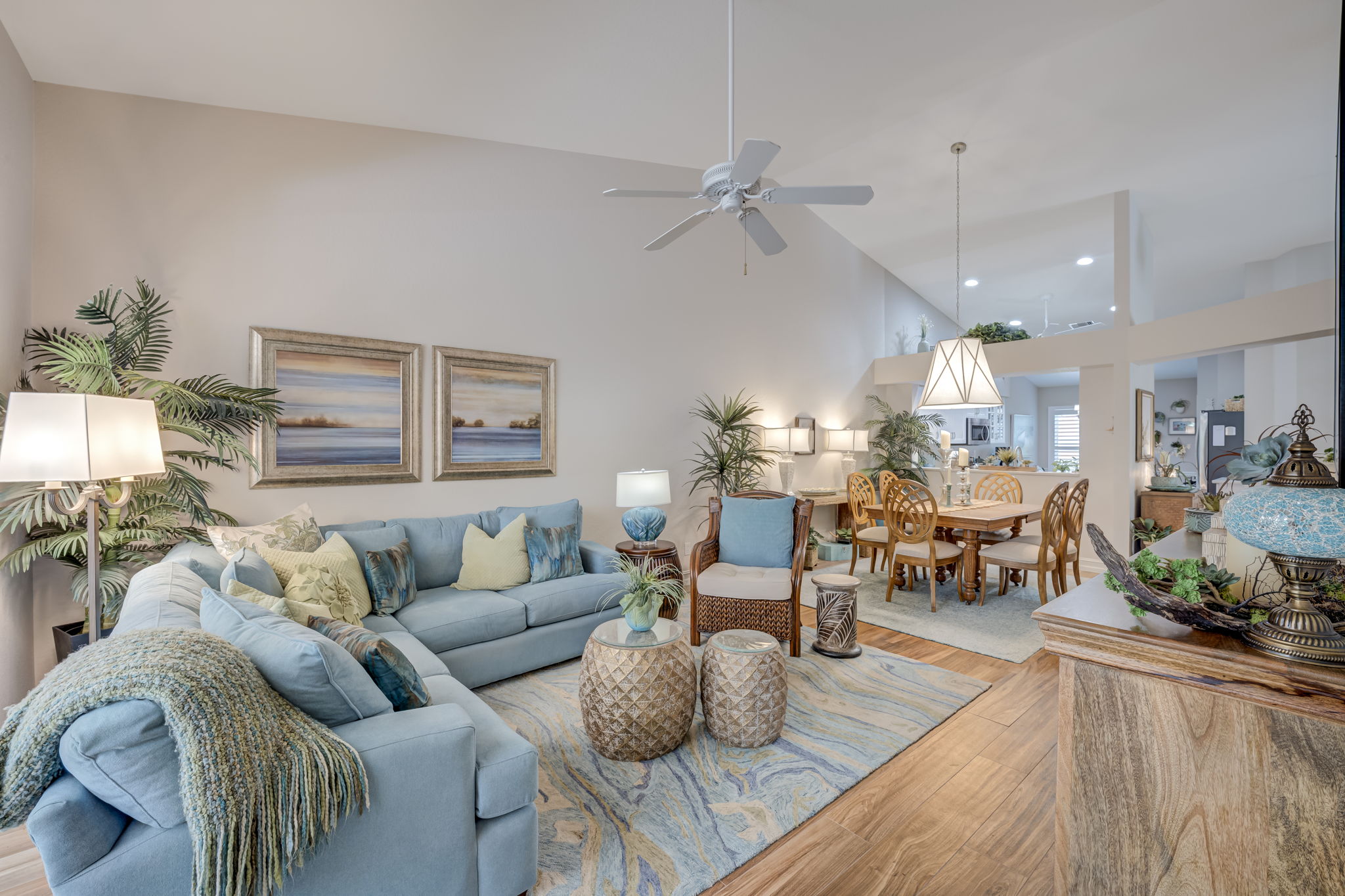Expansive living space highlighting the open architectural flow, elevated ceilings, and abundant natural light throughout