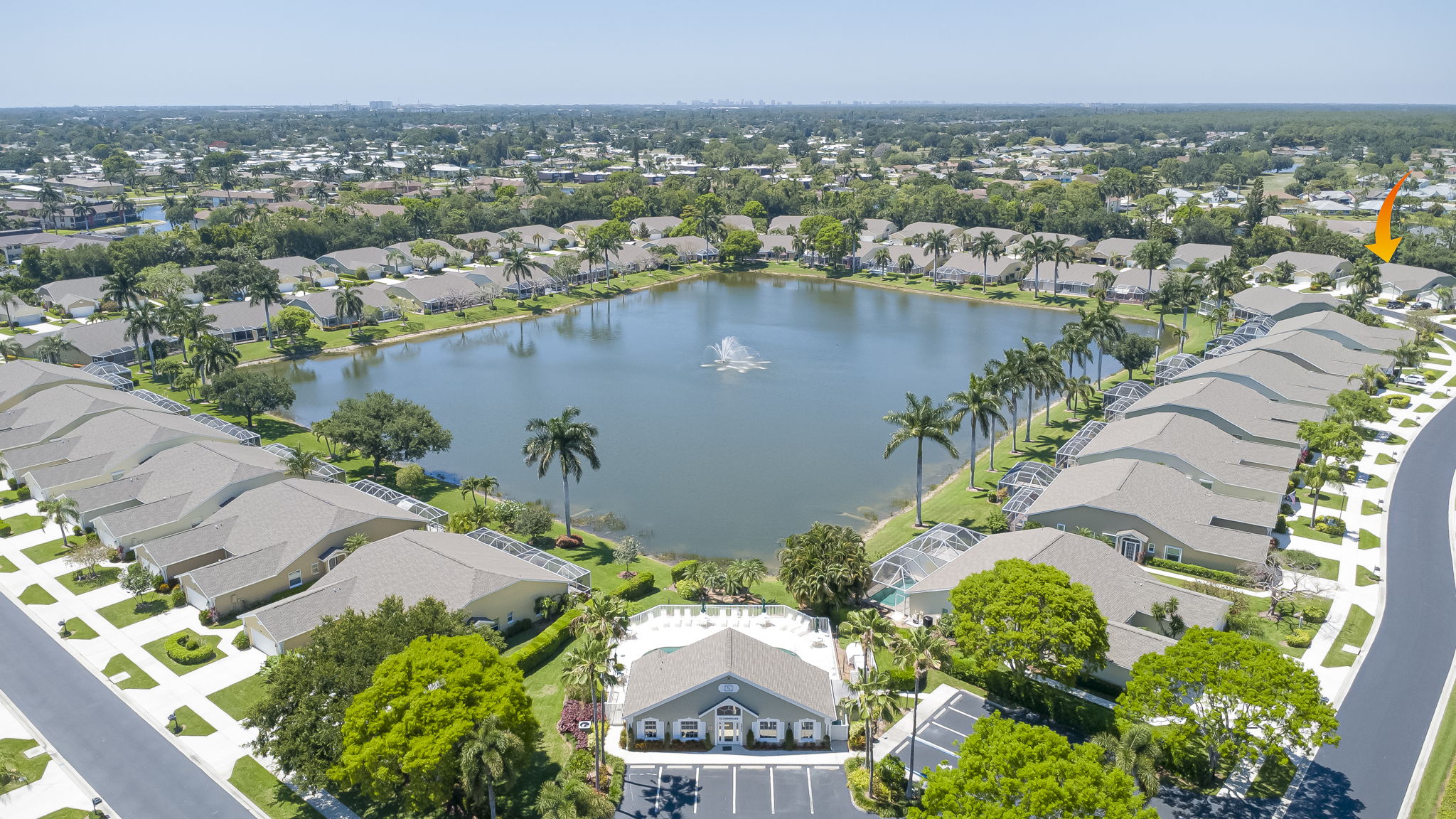 Stunning aerial community overview showcasing the expansive central lake, water features, and highly desirable Southwest Florida community