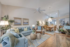 Expansive living space highlighting the open architectural flow, elevated ceilings, and abundant natural light throughout