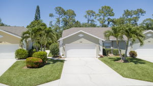 Wide-angle front elevation view highlighting the attached two-car garage, new paint and new roof