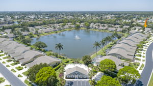 Stunning aerial community overview showcasing the expansive central lake, water features, and highly desirable Southwest Florida community