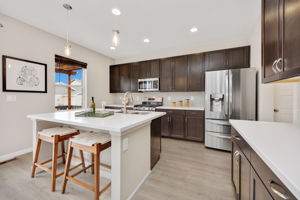Tons of storage in the kitchen, stainless appliances, custom cabinetry