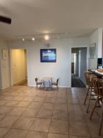 Dining area links kitchen and family rooms