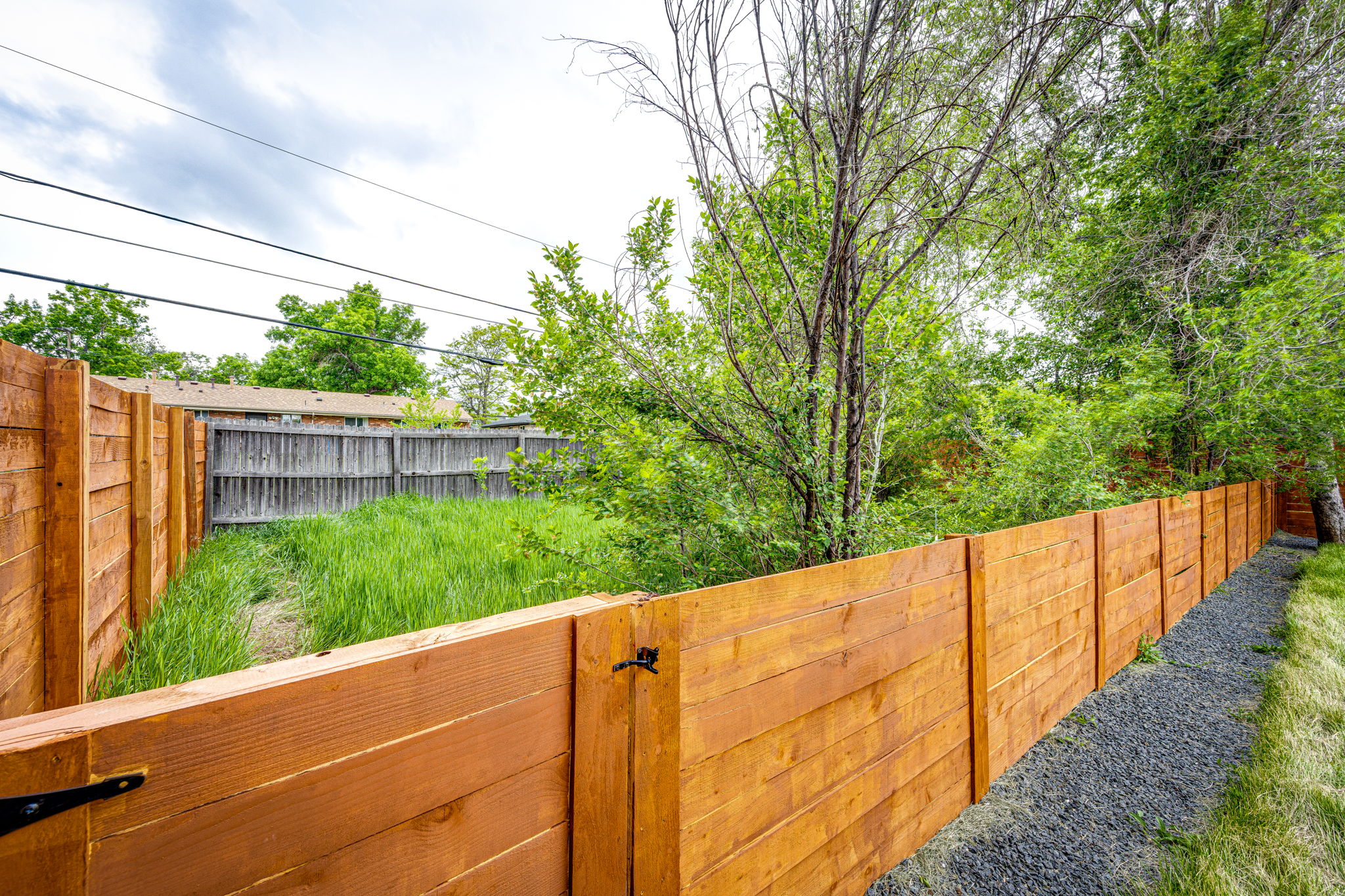Extra Fenced Backyard for Your 4-Legged Friend or Gardening