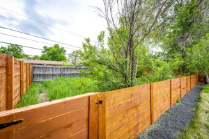 Extra Fenced Backyard for Your 4-Legged Friend or Gardening