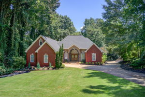 65 Aerial Exterior Front C w Yard + Driveway