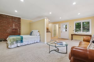 The in-law suite offers independent comfort with its own full bath and entrance from the garden. Perfect for visitors or work!