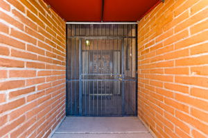Covered front entry with metal security door