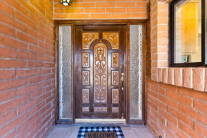 Charming wood front door welcomes you in