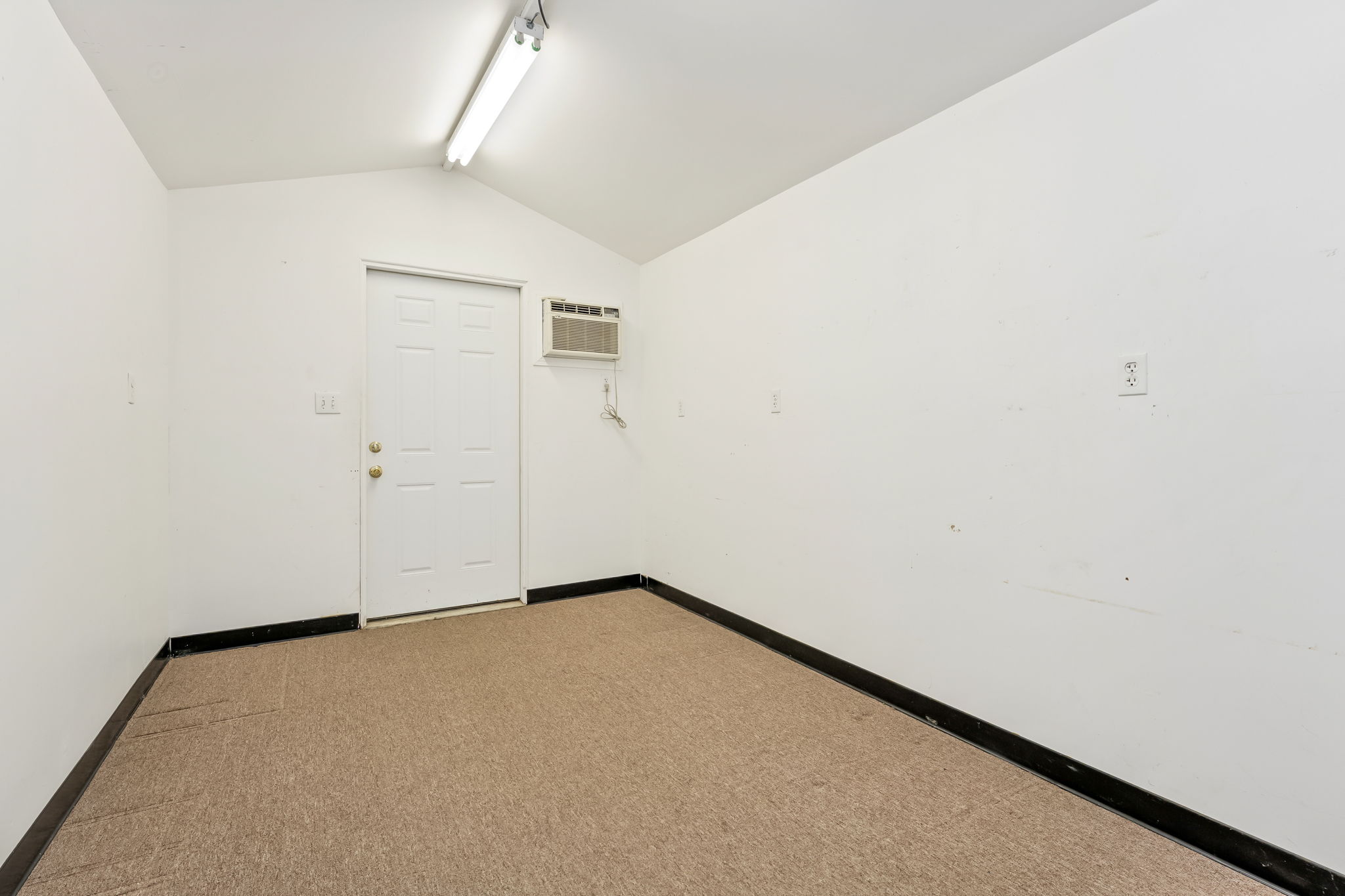 Flex Space #2 is finished and has a door to the Backyard.
