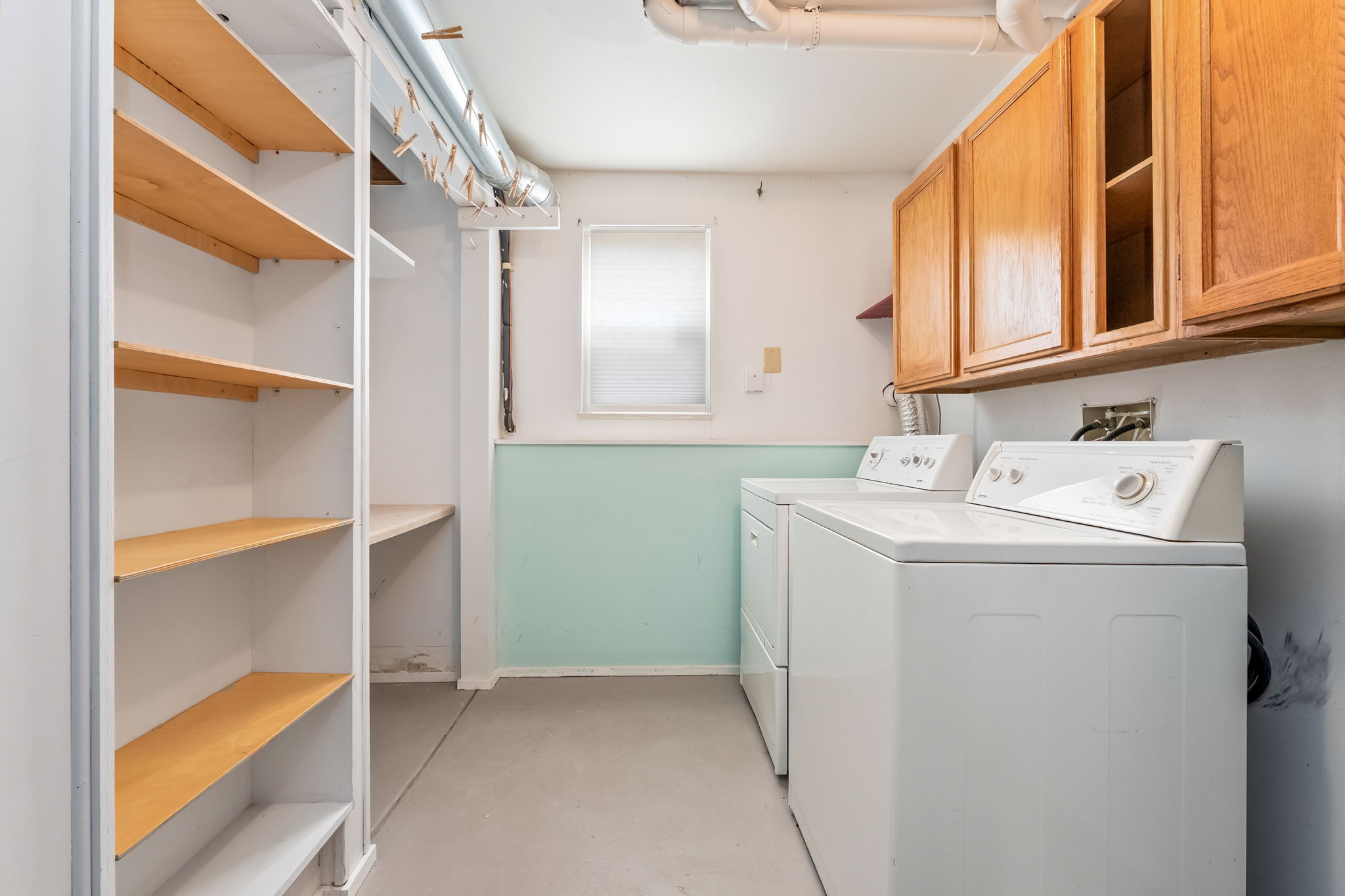 Laundry Room has a laundry chute, plenty of cabinet space, mechanical, and pocket door.